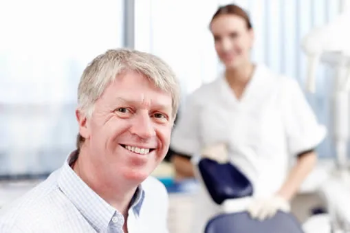 senior man at dentists office